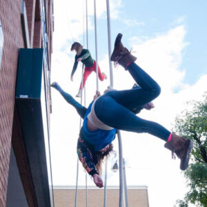 Two artists suspended in the air during Divergent Dances, a co-production with Public Energy at Artsweek 2020